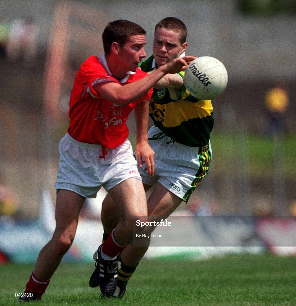 16 July 2000; John Collins of Cork in action against Declan Quill of Kerry during the Munster Minor Football Championship Final between Kerry and Cork at the Gaelic Grounds in Limerick. Photo by Ray Lohan/Sportsfile