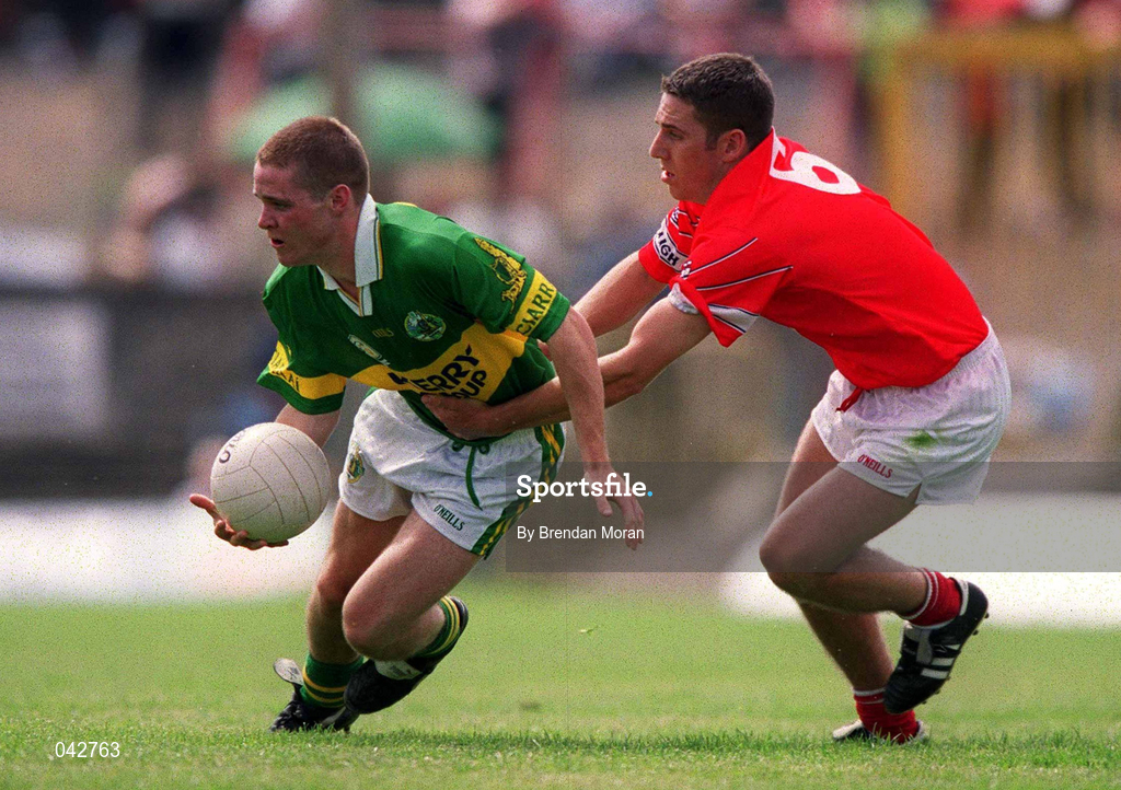 16 July 2000; Declan Quill of Kerry in action against Eddie Bourke of Cork during the Munster Minor Football Championship Final between Kerry and Cork at the Gaelic Grounds in Limerick. Photo By Brendan Moran/Sportsfile