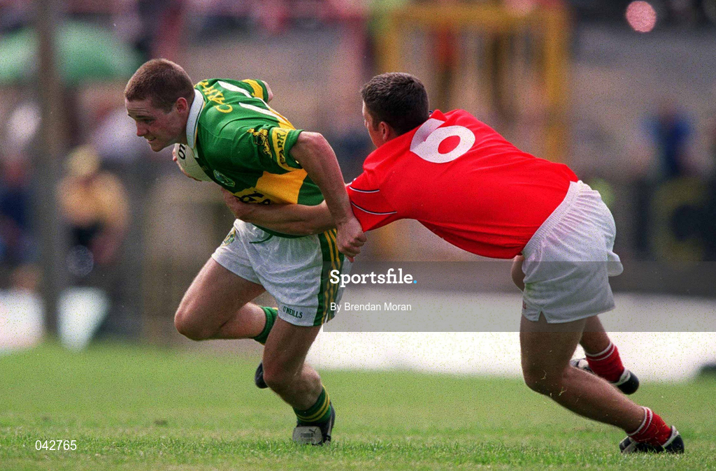 16 July 2000; Declan Quill of Kerry in action against Eddie Bourke of Cork during the Munster Minor Football Championship Final between Kerry and Cork at the Gaelic Grounds in Limerick. Photo By Brendan Moran/Sportsfile