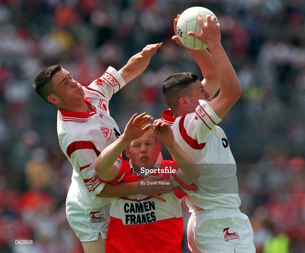 16 July 2000; Sean Kavanagh and Martin Penrose of Tyrone in action against Philip Mooney of Derry during the Ulster Minor Football Championship Final match between Tyrone and Derry at St Tiernach's Park in Clones, Monaghan. Photo by David Maher/Sportsfile