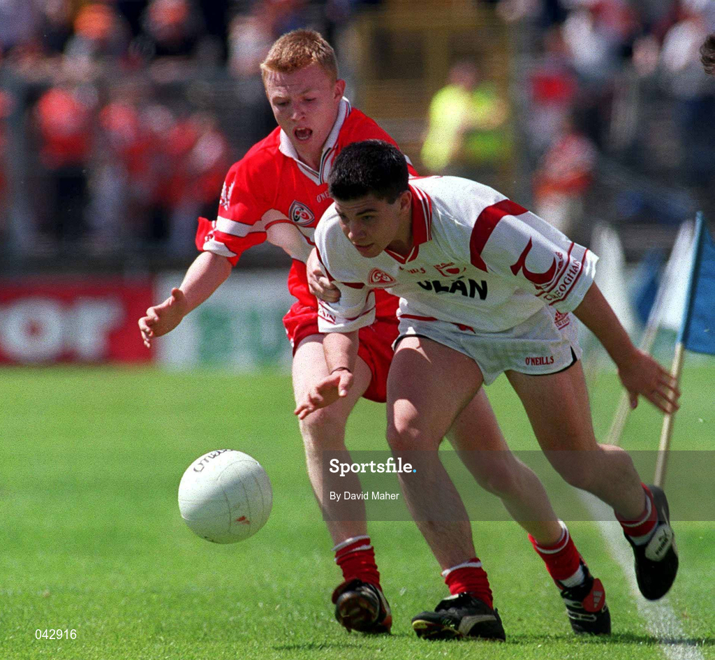 16 July 2000; Patrick Farrell of Tyrone in action against Cormac O'Neill of Derry during the Ulster Minor Football Championship Final match between Tyrone and Derry at St Tiernach's Park in Clones, Monaghan. Photo by David Maher/Sportsfile