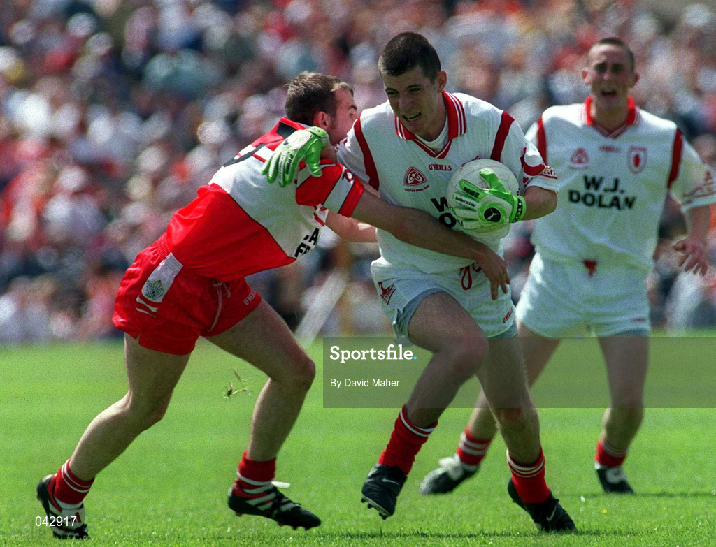 16 July 2000; Paddy McMahon of Tyrone in action against Colm Feeney of Derry during the Ulster Minor Football Championship Final match between Tyrone and Derry at St Tiernach's Park in Clones, Monaghan. Photo by David Maher/Sportsfile