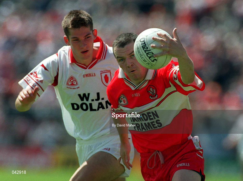 16 July 2000;Ciaran O'Neill of Derry in action against Shane Mallon of Tyrone during the Ulster Minor Football Championship Final match between Tyrone and Derry at St Tiernach's Park in Clones, Monaghan. Photo by David Maher/Sportsfile
