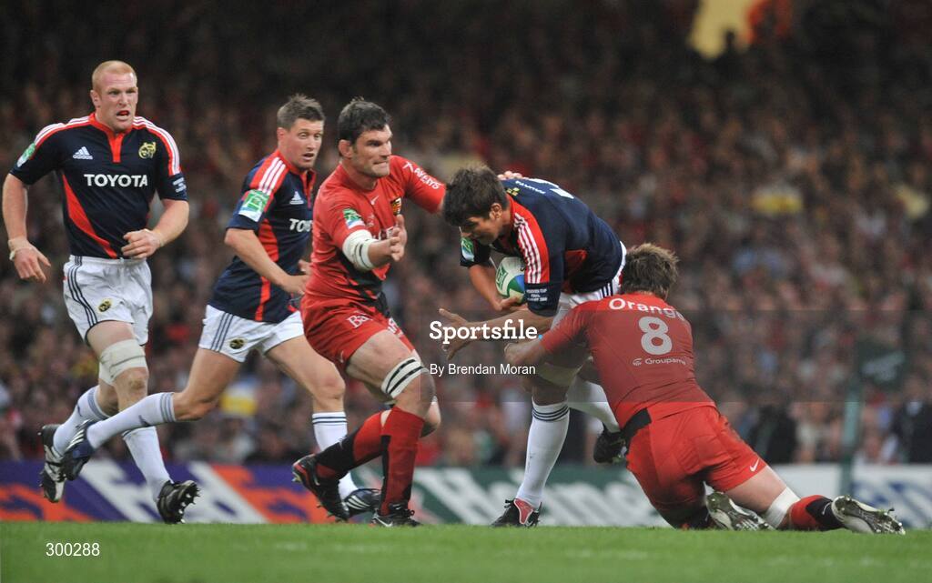 24 May 2008; Donncha O'Callaghan, Munster, is tackled by Fabien Pelous and Shaun Sowerby, 8, Toulouse. Heineken Cup Final, Munster v Toulouse, Millennium Stadium, Cardiff, Wales. Picture credit: Brendan Moran / SPORTSFILE