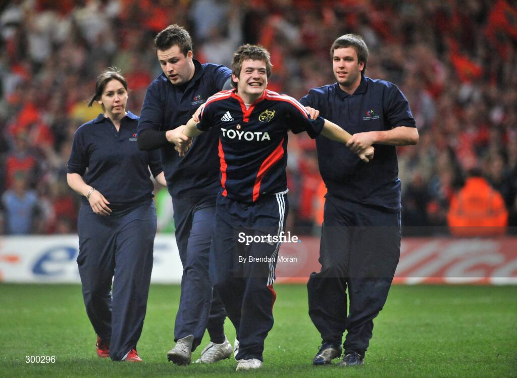 24 May 2008; A munster fan is removed from the pitch at the end of the game. Heineken Cup Final, Munster v Toulouse, Millennium Stadium, Cardiff, Wales. Picture credit: Brendan Moran / SPORTSFILE