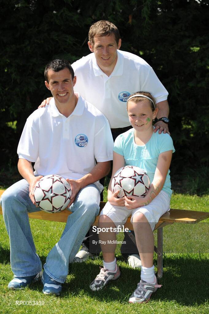 7 June 2008; Eight-year-old Brid Ryan from Rathmore, Co Kerry, with eircom league players Keith Fahey, left, St Patrick's Athletic, and Joe Gamble, Cork City, at the Danone Nations Cup National Finals. Brid was a finalist in the supporters competition. AUL Complex, Clonshaugh, Dublin. Picture credit: Ray McManus / SPORTSFILE  *** Local Caption *** kerry papers