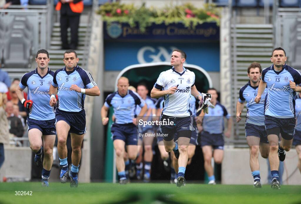 8 June 2008; Dublin players left to right, Ross McConnell, Paul Casey, Stpehen Cluxton and Alan Brogan run over to the team bench for a squad photograph before the start of the game. GAA Football Leinster Senior Championship Quarter-Final, Louth v Dublin, Croke Park, Dublin. Picture credit: David Maher / SPORTSFILE