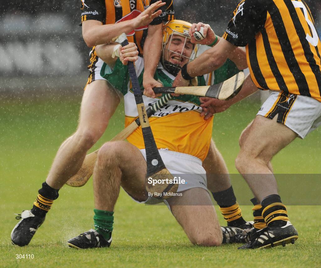 15 June 2008; Offaly's Brian Carroll under pressure from Kilkenny defenders Brian Hogan and JJ Delaney. GAA Hurling Leinster Senior Championship Semi-Final, Offaly v Kilkenny, O'Moore Park, Portlaoise, Co. Laois. Picture credit: Ray McManus / SPORTSFILE