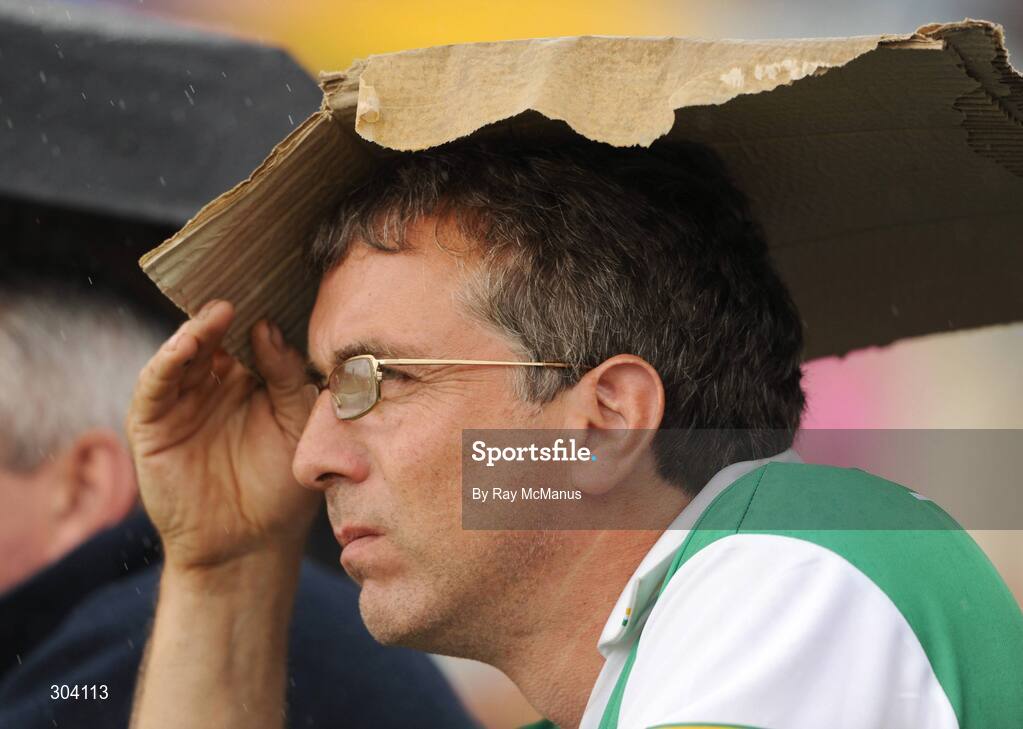 15 June 2008; An Offaly supporter takes shelter from the rain. GAA Hurling Leinster Senior Championship Semi-Final, Offaly v Kilkenny, O'Moore Park, Portlaoise, Co. Laois. Picture credit: Ray McManus / SPORTSFILE