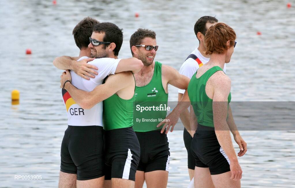 18 June 2008; Member of the Ireland Lightweight Men's Four Gearoid Towey, left, Paul Griffin and Cathal Moynihan with the Germans after finishing behind them in second place in a time of 6:06.34 and qualifying for the Olympic Games in Beijing in August. 2008 Final Olympic Rowing Qualification Regatta, Poznan, Poland. Picture credit: Brendan Moran / SPORTSFILE
