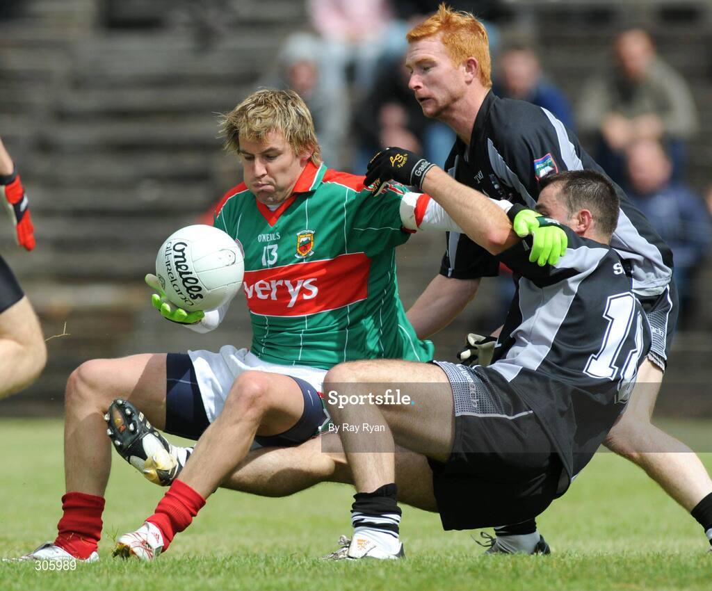 22 June 2008; Mayo's Conor Mortimer is brought down, and awarded a penalty, by Sligo's Brendan Philips. GAA Football Connacht Senior Championship Semi-Final, Mayo v Sligo, McHale Park, Castlebar, Co. Mayo. Picture credit: Ray Ryan / SPORTSFILE