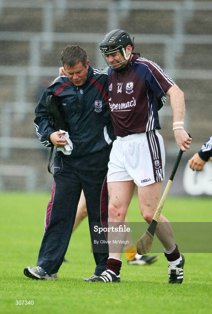28 June 2008; Eugene Cloonan, Galway, is assisted after getting injury during the game. All-Ireland Senior Championship Qualifier, Round 1, Antrim v Galway, Casement Park, Belfast, Co. Antrim. Picture credit: Oliver McVeigh / SPORTSFILE