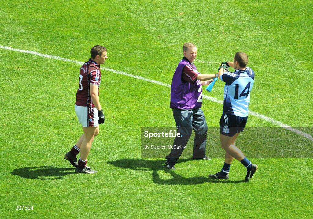 29 June 2008; Dublin's Conal Keaney squirts water at Westmeath Maor Uisce Jim Whelan after he tried to retrieve the bottle from which Keaney was drinking from during the first half as Westmeath full-back Kieran Gavin watches on. GAA Football Leinster Senior Championship Semi-Final, Dublin v Westmeath, Croke Park, Dublin. Picture credit: Stephen McCarthy / SPORTSFILE