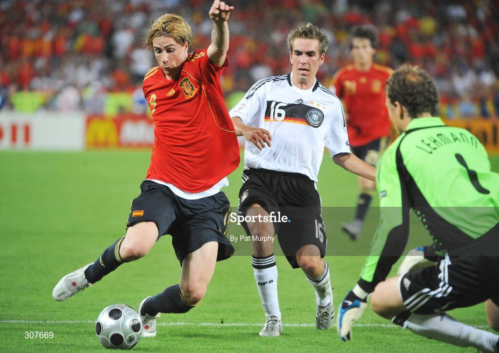 29 June 2008; Fernando Torres of Spain prepares to put the ball past Jens Lehmann of Germany to score Spains first goal despite the attentions of Philipp Lahm of Germany during the 16 UEFA EURO 2008TM Final match between Germany and Spain at Ernst Happel Stadion, Vienna, Austria. Photo by Pat Murphy/Sportsfile