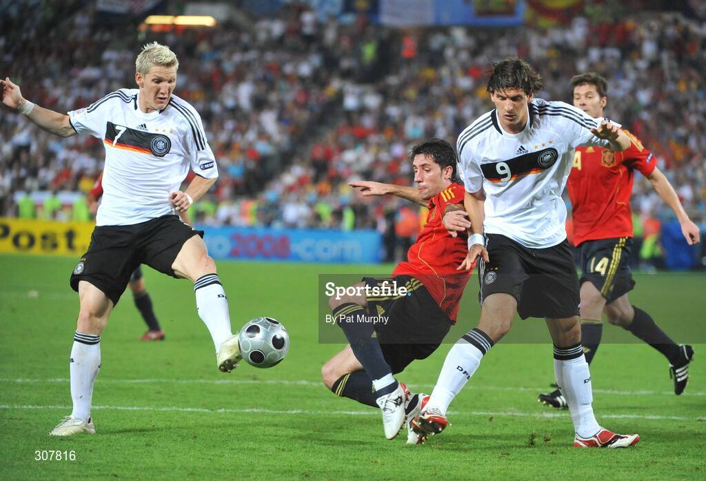 29 June 2008; Joan Capdevila, Spain, in action against Bastian Schweinsteiger, left, and Mario Gomez, Germany. UEFA EURO 2008TM, Final, Germany v Spain, Ernst Happel Stadion, Vienna, Austria. Picture credit; Pat Murphy / SPORTSFILE