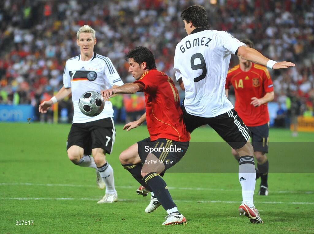 29 June 2008; Joan Capdevila, Spain, in action against Bastian Schweinsteiger, left, and Mario Gomez, Germany. UEFA EURO 2008TM, Final, Germany v Spain, Ernst Happel Stadion, Vienna, Austria. Picture credit; Pat Murphy / SPORTSFILE