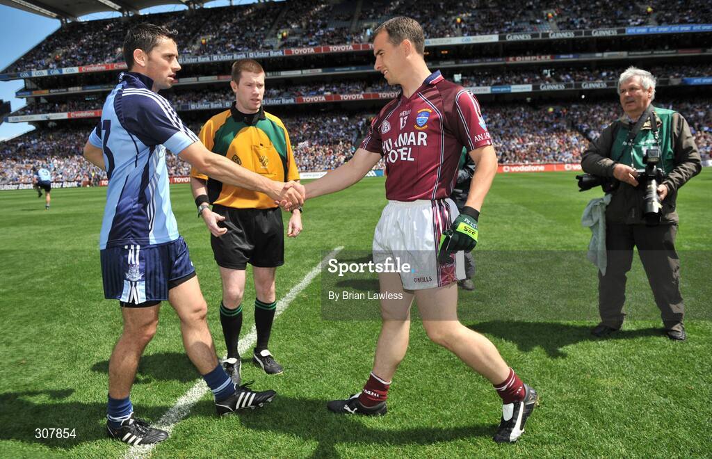 29 June 2008; Captains Des Dolan, Westmeath, and Alan Brogan, Dublin, shake hands in the company of referee Padraig Hughes. GAA Football Leinster Senior Championship Semi-Final, Dublin v Westmeath, Croke Park, Dublin. Picture credit: Brian Lawless / SPORTSFILE