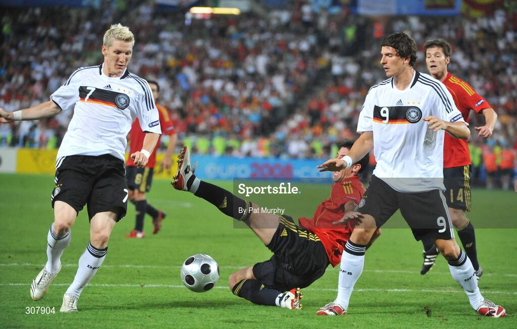 29 June 2008; Joan Capdevila, Spain, in action against Bastian Schweinsteiger, left, and Mario Gomez, Germany. UEFA EURO 2008TM, Final, Germany v Spain, Ernst Happel Stadion, Vienna, Austria. Picture credit; Pat Murphy / SPORTSFILE