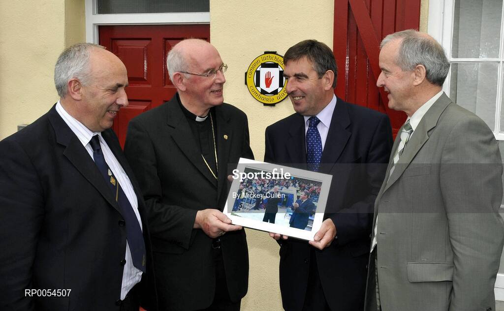 30 June 2008; Cardinal Sean Brady receives a momento from Tom Daly, President of the Ulster Council, Danny Murphy, left, and Michael Hasson. Ulster Council Offices, Armagh. Picture credit: Mickey Cullen / SPORTSFILE