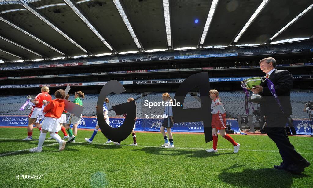 30 June 2008; Pól O'Gallchóir, Ceannasai, TG4, follows children carrying TG4 branding out on to the field at the TG4 All-Ireland Ladies Football Championship Launch. Croke Park, Dublin. Photo by Sportsfile