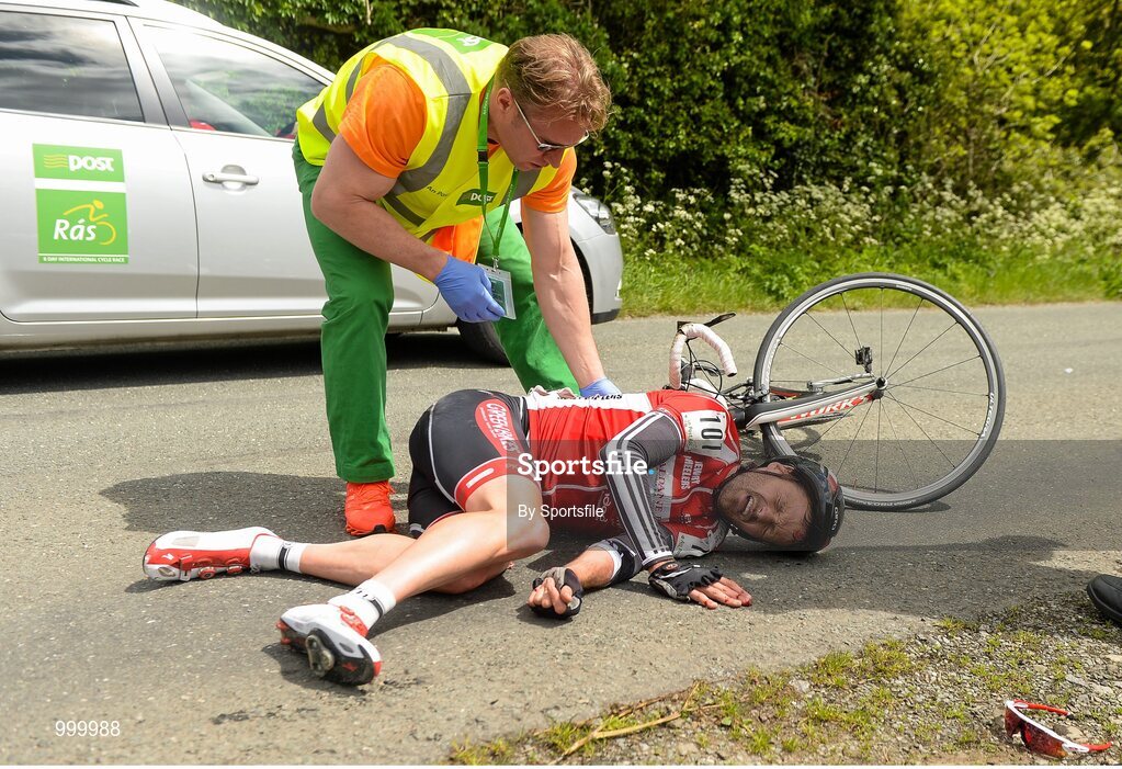 24 May 2015; Sean Featherstone, Newry Wheelers, is attended to after beng involved in an accident during Stage 8 of the 2015 An Post Rás. Drogheda - Skerries. Photo by Sportsfile