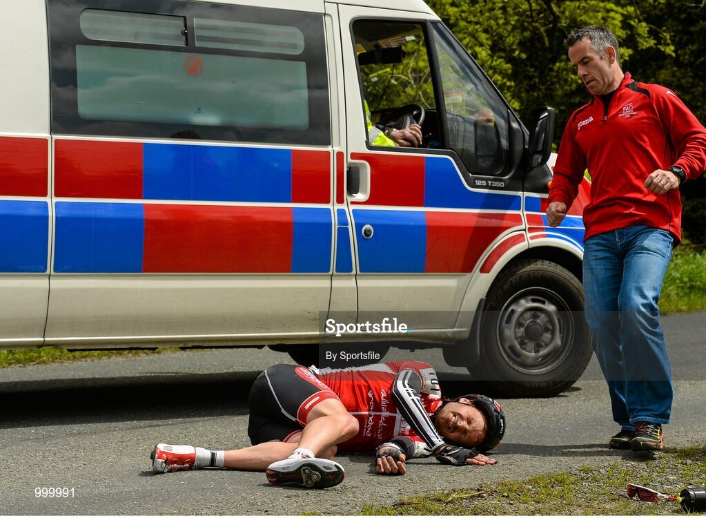 24 May 2015; Sean Featherstone, Newry Wheelers, lies on the ground after beng involved in an accident during Stage 8 of the 2015 An Post Rás. Drogheda - Skerries. Photo by Sportsfile