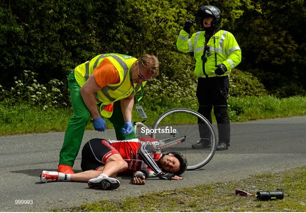 24 May 2015; Sean Featherstone, Newry Wheelers, lies on the ground after beng involved in an accident during Stage 8 of the 2015 An Post Rás. Drogheda - Skerries. Photo by Sportsfile
