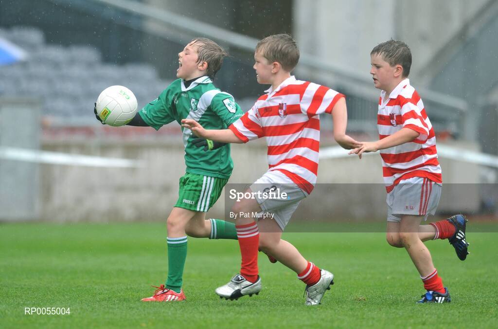 10 July 2008; Billy Campbell, Sarsfields, in action against Tommy Martin, left, and Sean Monaghan, Cappagh, during the Leinster - Play and Stay with GAA Go Games activity day which saw over 700 children take part in games in both hurling and football on six pitches at Croke Park, Dublin. Picture credit: Pat Murphy / SPORTSFILE