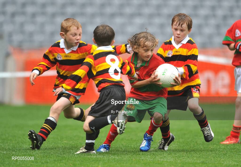 10 July 2008; Terrence Kelly, Dundalk, in action against, from left, Drew Costello, Ben Culleton and Barney Kelly, Ardclough, during the Leinster - Play and Stay with GAA Go Games activity day which saw over 700 children take part in games in both hurling and football on six pitches at Croke Park, Dublin. Picture credit: Pat Murphy / SPORTSFILE