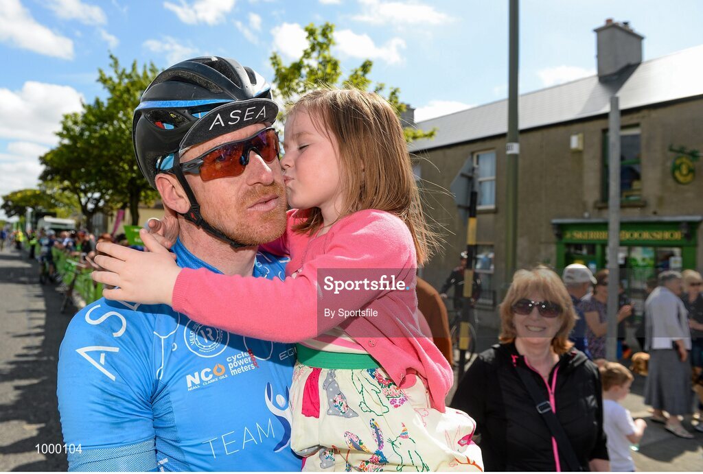 24 May 2015; Bryan McCrystal, Team Asea, gets a kiss from his daughter Eire, aged 6, after finishing Stage 8 of the 2015 An Post Rás. Drogheda - Skerries. Photo by Sportsfile