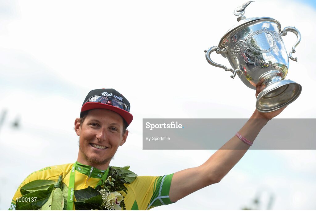24 May 2015; Lukas Postlberger, Tirol Cycling Team, celebrates with the George Plant trophy following Stage 8 of the 2015 An Post Rás. Drogheda - Skerries. Photo by Sportsfile