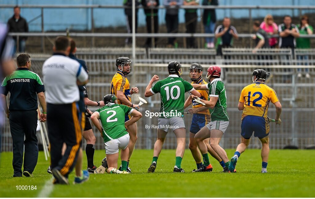 24 May 2015; Clare and  Limerick players tussel with each other moments before half time. Referee Colm Lyons issued a red card to Patrick Donnellan shortly after. Munster GAA Hurling Senior Championship Quarter-Final, Clare v Limerick. Semple Stadium, Thurles, Co. Tipperary. Picture credit: Ray McManus / SPORTSFILE