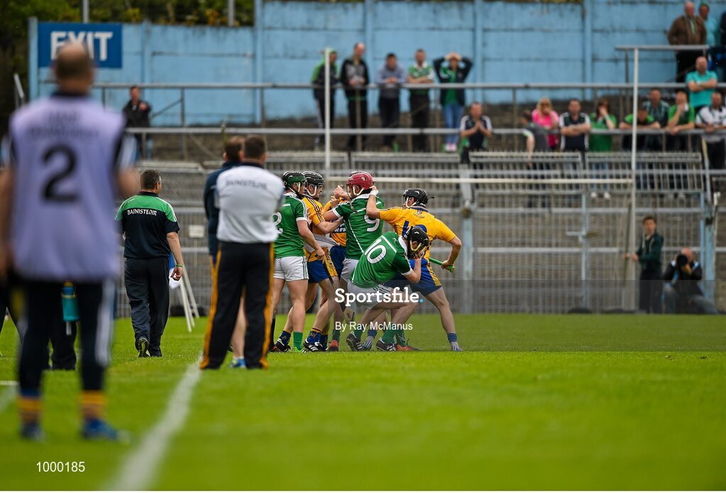 24 May 2015; Clare and  Limerick players tussel with each other moments before half time. Referee Colm Lyons issued a red card to Patrick Donnellan shortly after. Munster GAA Hurling Senior Championship Quarter-Final, Clare v Limerick. Semple Stadium, Thurles, Co. Tipperary. Picture credit: Ray McManus / SPORTSFILE