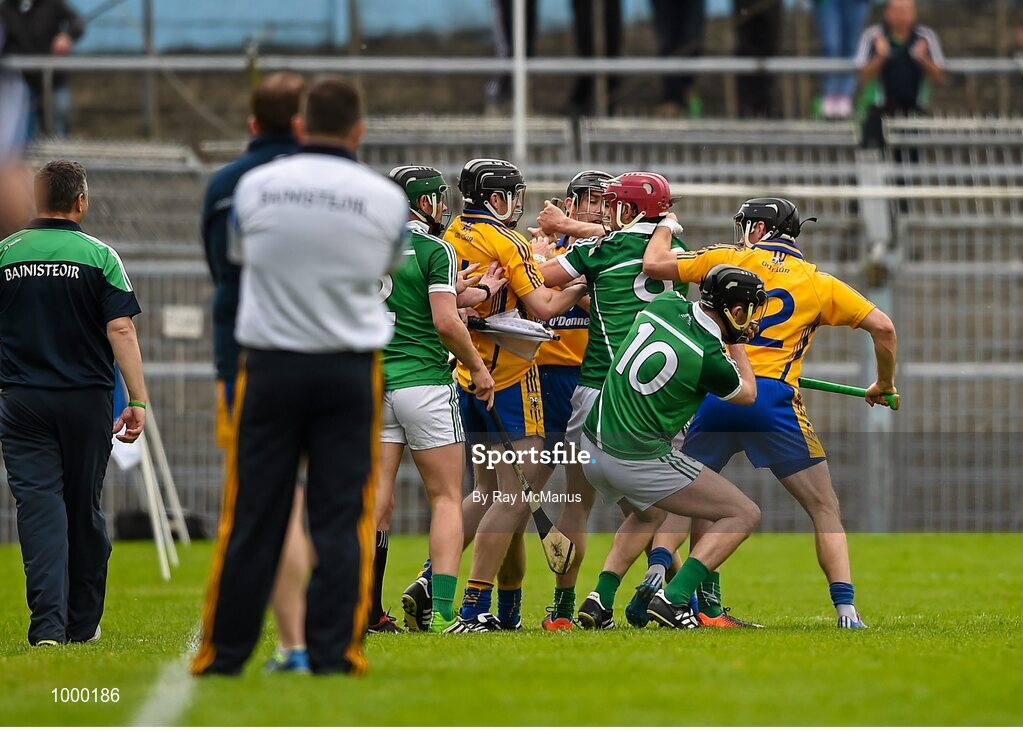 24 May 2015; Clare and  Limerick players tussel with each other moments before half time. Referee Colm Lyons issued a red card to Patrick Donnellan shortly after. Munster GAA Hurling Senior Championship Quarter-Final, Clare v Limerick. Semple Stadium, Thurles, Co. Tipperary. Picture credit: Ray McManus / SPORTSFILE