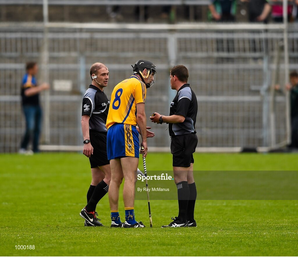 24 May 2015; linesman Sean Cleere, left, looks on as referee Colm Lyons speaks to Clare's Patrick Donnellan before issuing him a red card on the stroke of half time.  Munster GAA Hurling Senior Championship Quarter-Final, Clare v Limerick. Semple Stadium, Thurles, Co. Tipperary. Picture credit: Ray McManus / SPORTSFILE