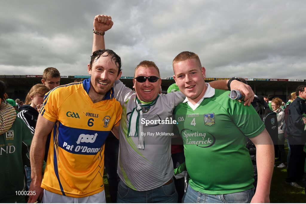24 May 2015; Limerick's Paudie O'Brien, wearing a Clare jersey, celebrates with Limerick supporters Noel Copse and his son Kieran, from Ardagh, after the game. Munster GAA Hurling Senior Championship Quarter-Final, Clare v Limerick. Semple Stadium, Thurles, Co. Tipperary. Picture credit: Ray McManus / SPORTSFILE