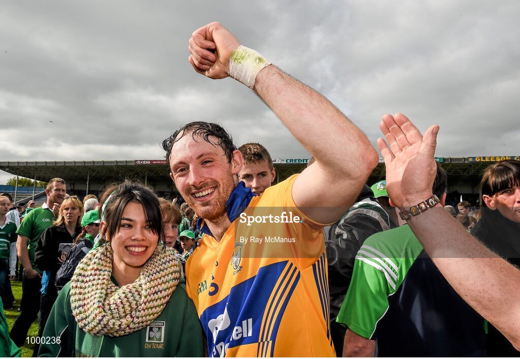 24 May 2015; Limerick's Paudie O'Brien, wearing a Clare jersey, celebrates with Limerick supporters after the game. Munster GAA Hurling Senior Championship Quarter-Final, Clare v Limerick. Semple Stadium, Thurles, Co. Tipperary. Picture credit: Ray McManus / SPORTSFILE