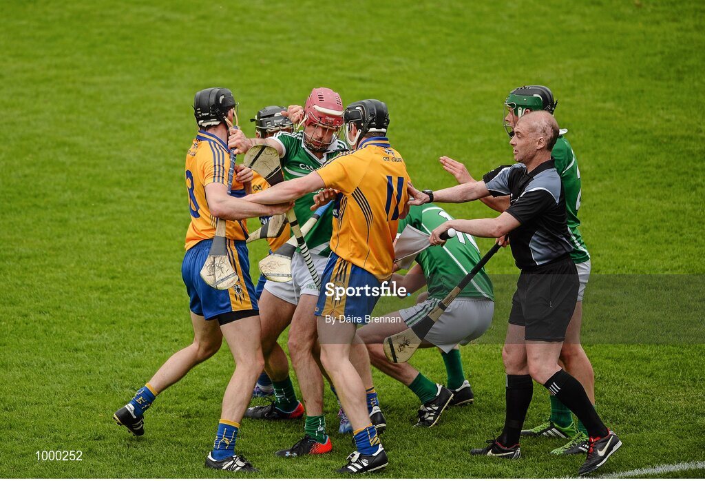 24 May 2015; Donal O'Grady, Limerick, falls to the ground after being struck by Patrick Donnellan, Clare, which resulted in Donnellan receiveing a red card. Munster GAA Hurling Senior Championship Quarter-Final, Clare v Limerick. Semple Stadium, Thurles, Co. Tipperary. Picture credit: Dáire Brennan / SPORTSFILE