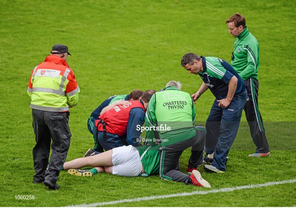 24 May 2015; Limerick manager TJ Ryan checks up on Donal O'Grady, after being struck, which resulted in Patrick Donnellan, Clare, being shown the red card. Munster GAA Hurling Senior Championship Quarter-Final, Clare v Limerick. Semple Stadium, Thurles, Co. Tipperary. Picture credit: Dáire Brennan / SPORTSFILE