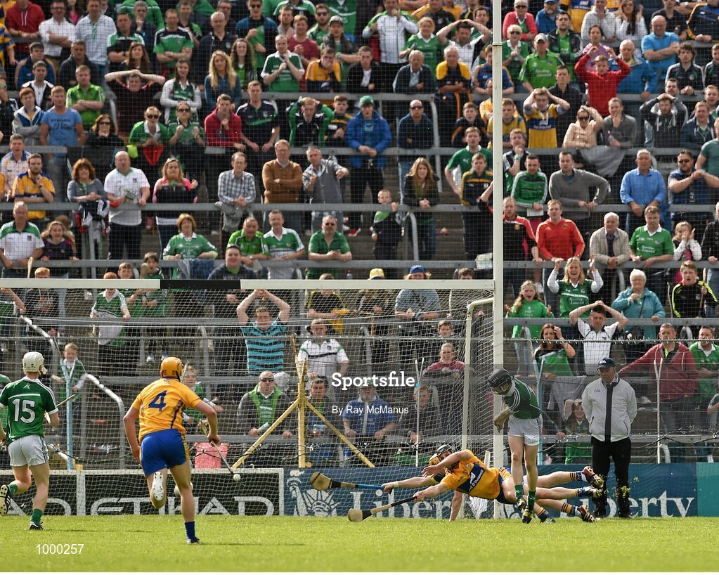 24 May 2015; Graeme Mulcahy, Limerick, shoots past the Clare corner back Domhnall O'Donovan and goalkeeper Patrick Kelly to score a goal in the 52nd minute. Munster GAA Hurling Senior Championship Quarter-Final, Clare v Limerick. Semple Stadium, Thurles, Co. Tipperary. Picture credit: Ray McManus / SPORTSFILE