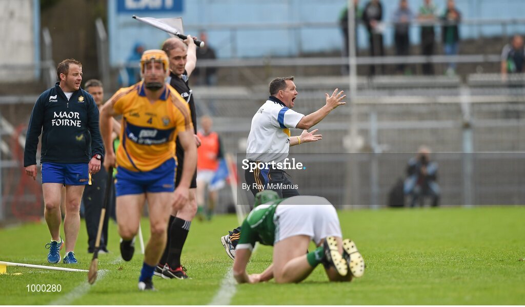 24 May 2015; The Clare manager Davy Fitzgerald reacts as Cian Dillon, Clare, and Shane Dowling, Limerick, fall over the sideline. Moments later Fitzgerald was cautioned by the referee. Munster GAA Hurling Senior Championship Quarter-Final, Clare v Limerick. Semple Stadium, Thurles, Co. Tipperary. Picture credit: Ray McManus / SPORTSFILE