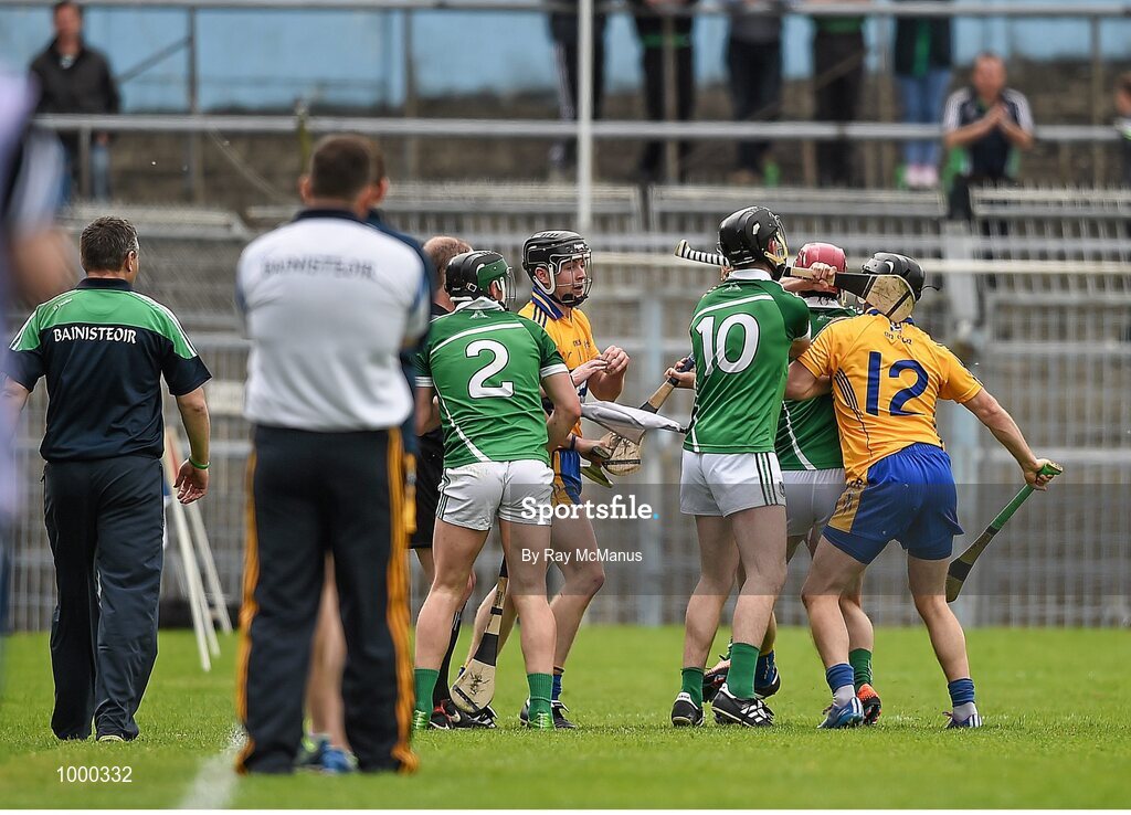 24 May 2015; Clare and Limerick players tussel with each other moments before half time. Referee Colm Lyons issued a red card to Patrick Donnellan shortly after and the Limerick captain Donal O'Grady, 10, was treated for an injury to the face. Munster GAA Hurling Senior Championship Quarter-Final, Clare v Limerick. Semple Stadium, Thurles, Co. Tipperary.  Picture credit: Ray McManus / SPORTSFILE