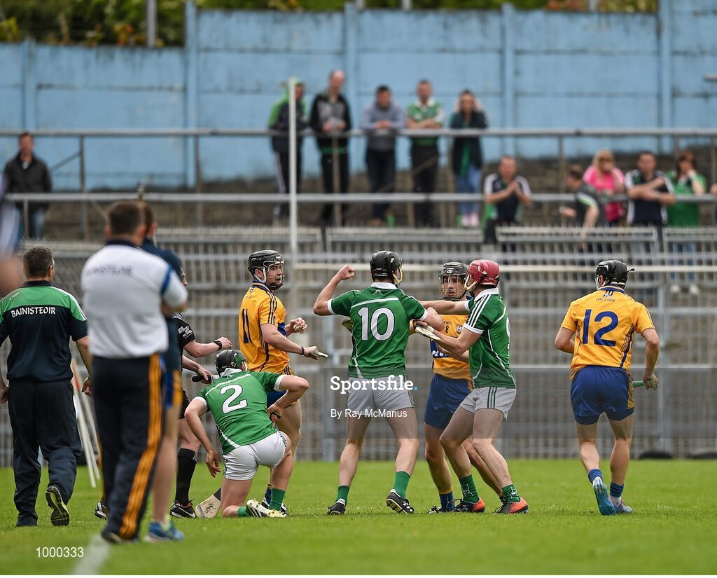 24 May 2015; Clare and Limerick players tussel with each other moments before half time. Referee Colm Lyons issued a red card to Patrick Donnellan shortly after and the Limerick captain Donal O'Grady, 10, was treated for an injury to the face. Munster GAA Hurling Senior Championship Quarter-Final, Clare v Limerick. Semple Stadium, Thurles, Co. Tipperary.  Picture credit: Ray McManus / SPORTSFILE