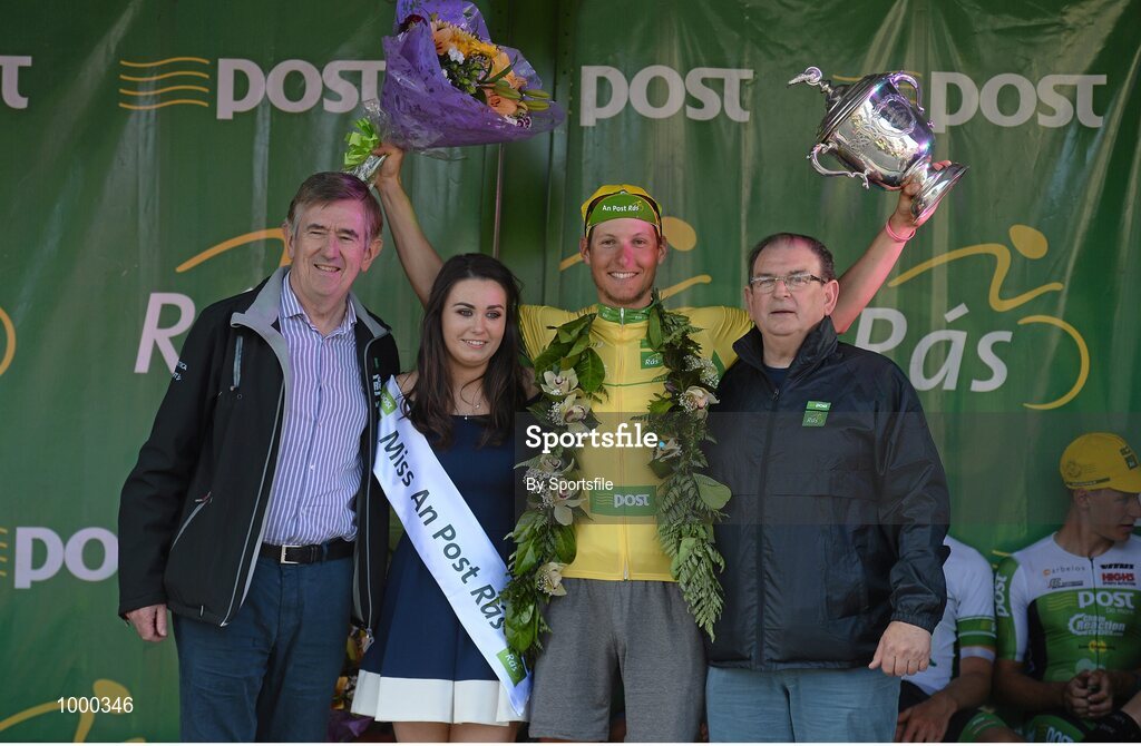 24 May 2015; Lukas Postlberger, Tirol Cycling Team, after receiving the An Post Rás Yellow Jersey Classification and the George Plant trophy following Stage 8 from Miss An Post Rás Aisling Halpin, Donal Connell, left, CEO, An Post, and Race Director Tony Campbell, following Stage 8 of the 2015 An Post Rás. Drogheda - Skerries. Photo by Sportsfile