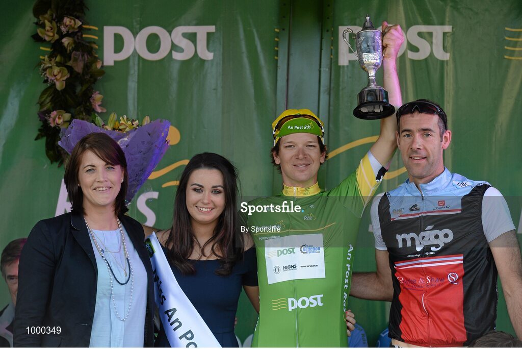 24 May 2015; Aaron Gate, An Post Chain reaction, after receiving the Post Office Sprint Jersey Classification and the Kieran McMahon trophy from Miss An Post Rás Aisling Halpin, Bronagh O'Sullivan and Paul Deans, Skerries Organiser, following Stage 8 of the 2015 An Post Rás. Drogheda - Skerries. Photo by Sportsfile