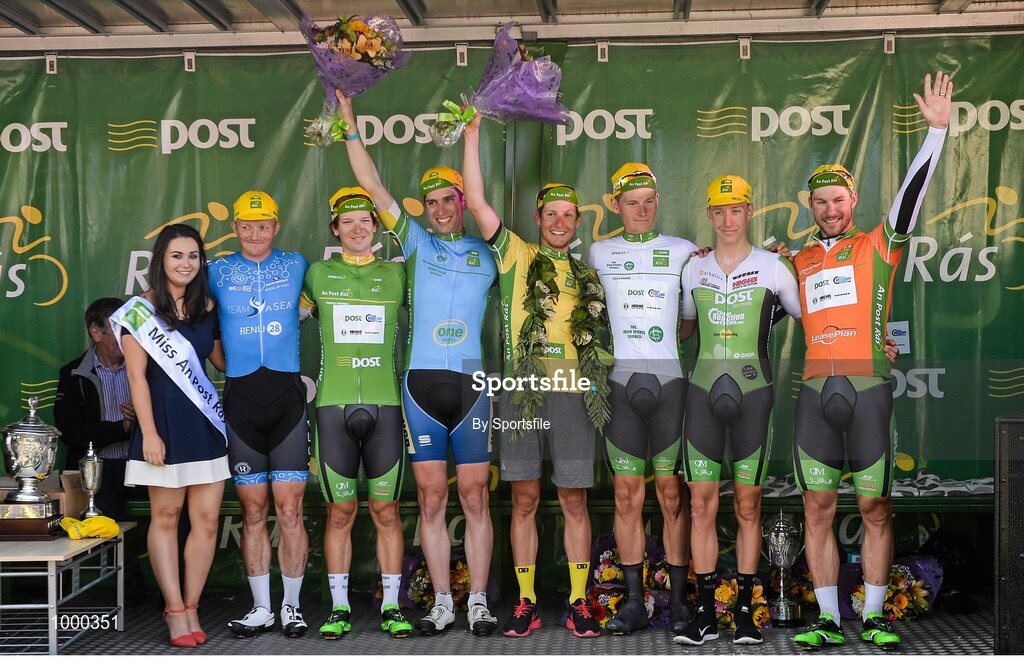 24 May 2015; Miss An Post Rás Aisling Halpin with, from left,: first county rider home Damien Shaw, Team Asea;  Post Office Sprint Jersey Classification winner Aaron Gate, An Post Chain Reaction; One Direct County Jersey winner Ian Richardson, UCD; An Post Rás Yellow Jersey Classification winner Lukas Postlberger; Irish Sports Council U23 White Jersey Classification winner and third place overall Ryan Mullen, An Post Chain Reaction; second place overall, Joshua Edmondson, An Post Chain Reaction; and One4All Bikes4Work King of the Mountains Jersey Classification winner and LeasePlan Stage Jersey winner Aidis Kruopis, An Post Chain Reaction, following Stage 8 of the 2015 An Post Rás. Drogheda - Skerries. Photo by Sportsfile