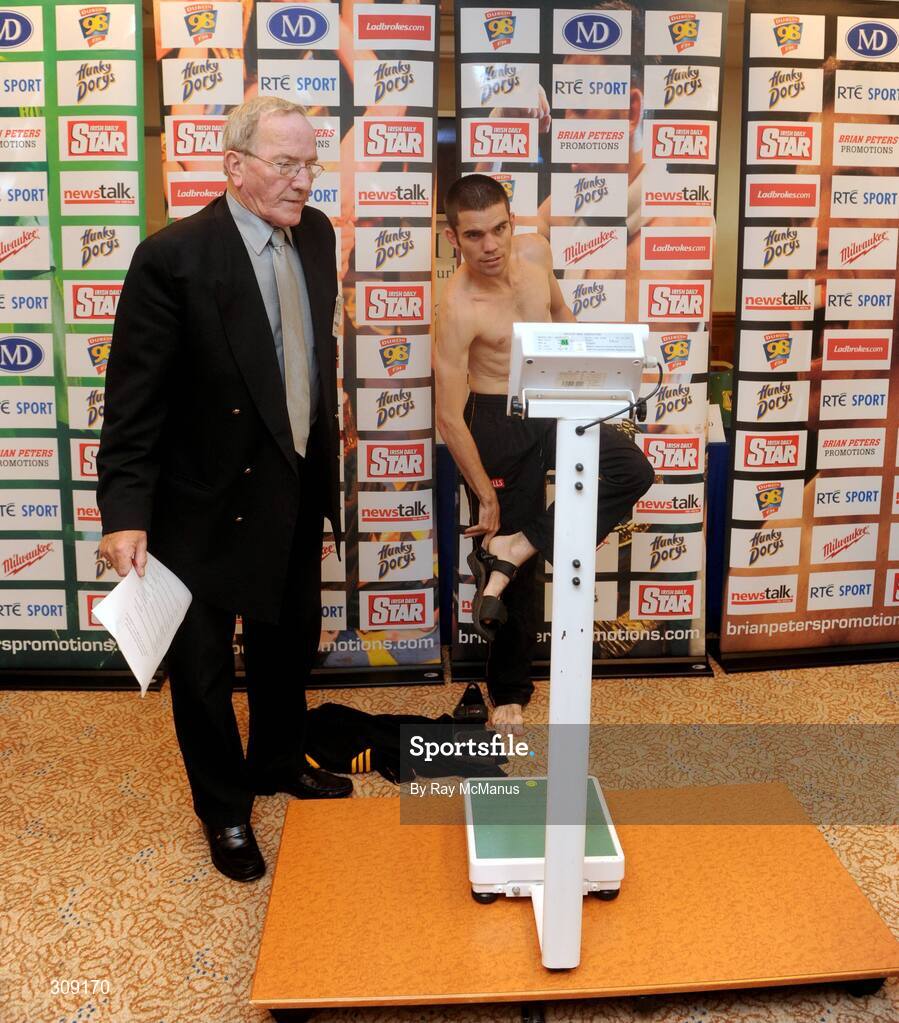 11 July 2008; Boxing Union of Ireland official Tony Lee looks on as Bernard Dunne prepares to check his weight about 10 minutes before the official weigh-in ahead of the Hunky Dory's Fight Night this Saturday July 12th at the National Stadium, Dublin. Burlington Hotel, Dublin. Picture credit: Ray McManus / SPORTSFILE