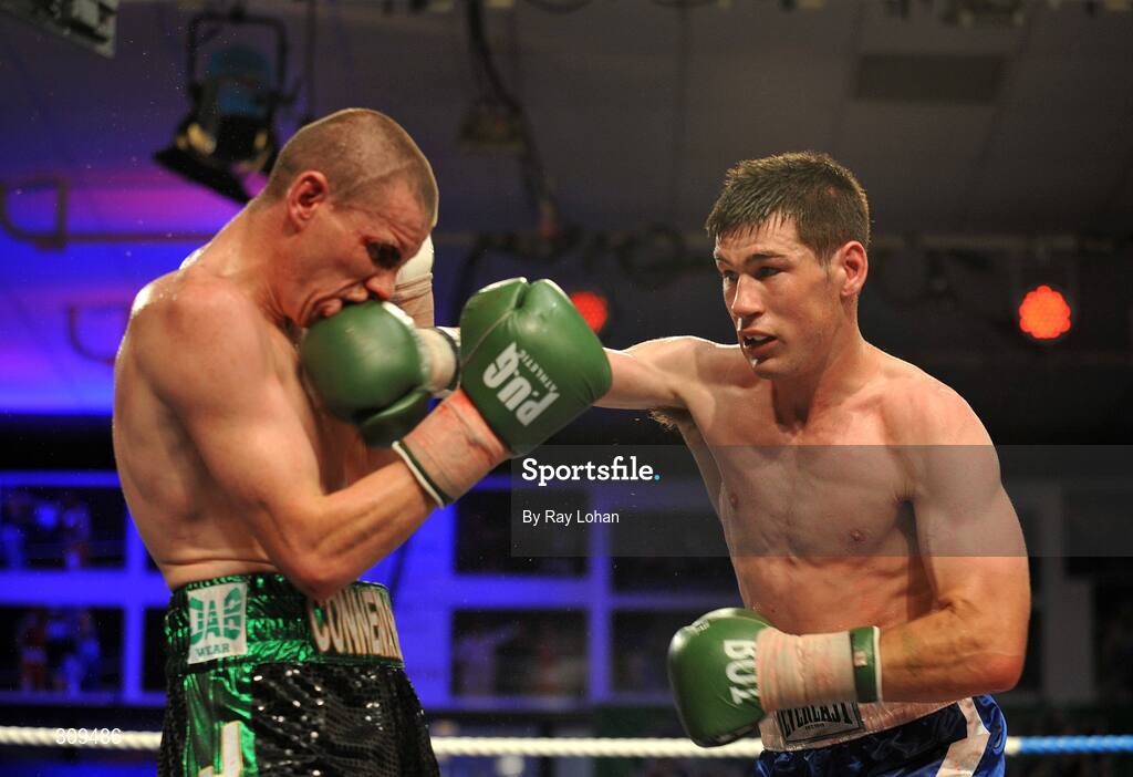 12 July 2008; Andrew Murray, right, lands a punch on Peter McDonagh. Irish Lightweight Championship, Hunky Dory Fight Night, Irish Lighweight Championship, National Stadium, Dublin. Picture credit: Ray Lohan / SPORTSFILE *** Local Caption ***