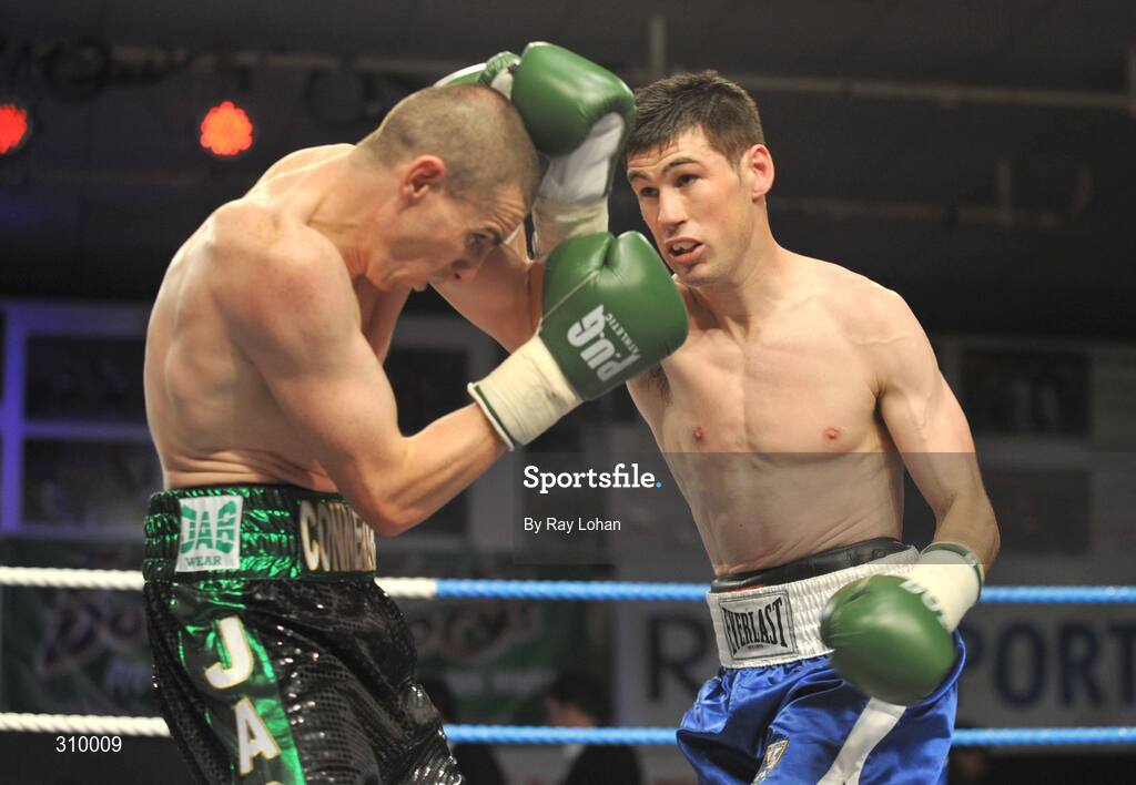 12 July 2008; Peter McDonagh, right, lands a punch on Andrew Murray, Irish Lightweight Championship, Hunky Dory Fight Night, Irish Lighweight Championship, National Stadium, Dublin. Picture credit: Ray Lohan / SPORTSFILE *** Local Caption ***