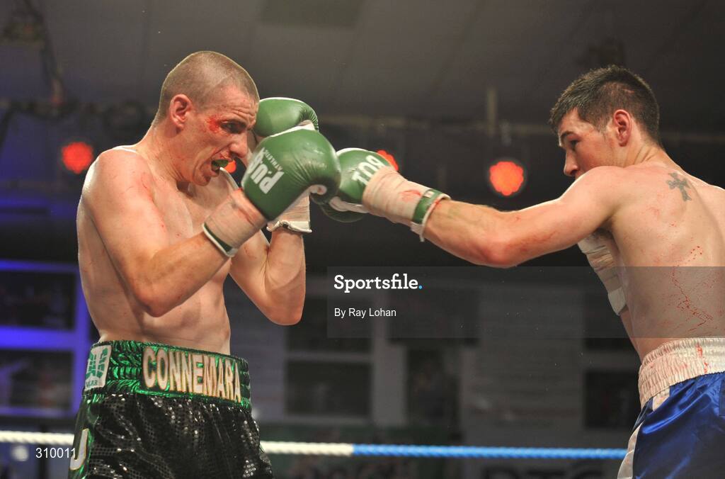 12 July 2008; Andrew Murray, right, lands a punch on Peter McDonagh. Irish Lightweight Championship, Hunky Dory Fight Night, Irish Lighweight Championship, National Stadium, Dublin. Picture credit: Ray Lohan / SPORTSFILE *** Local Caption ***